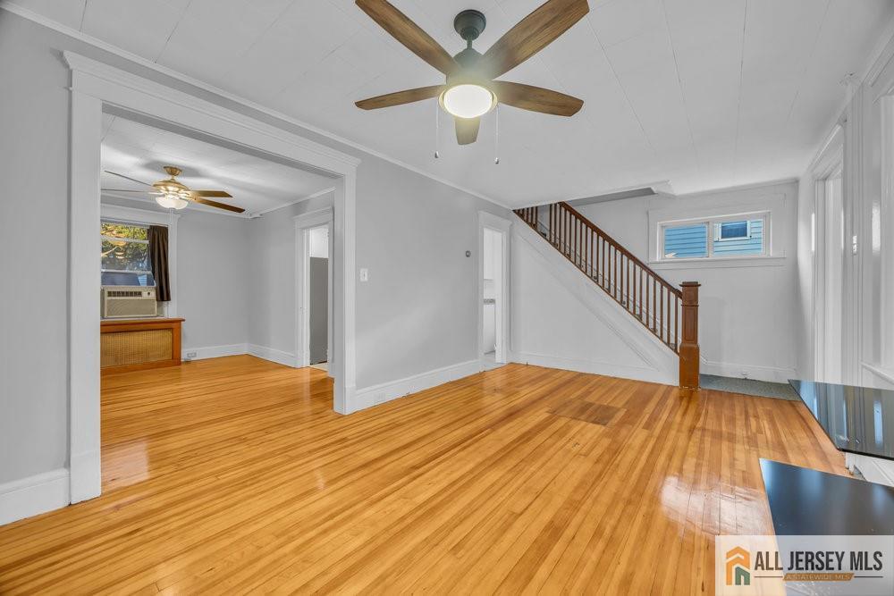34 Maple Avenue Edison, NJ 08837 - Photo 6 of 20 a view of entryway and hall with wooden floor