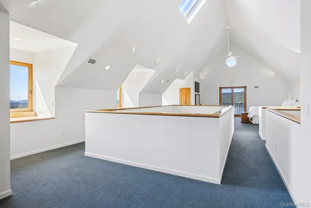 a view of a kitchen with furniture and a window
