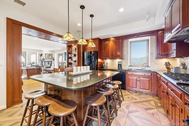 a dining table chairs and a kitchen view
