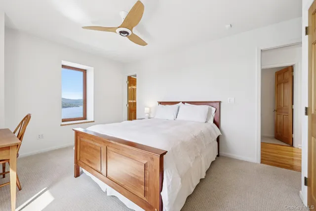 a bed room with a bed and a window