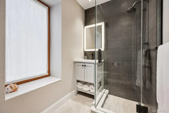 a bathroom with a shower and a toilet