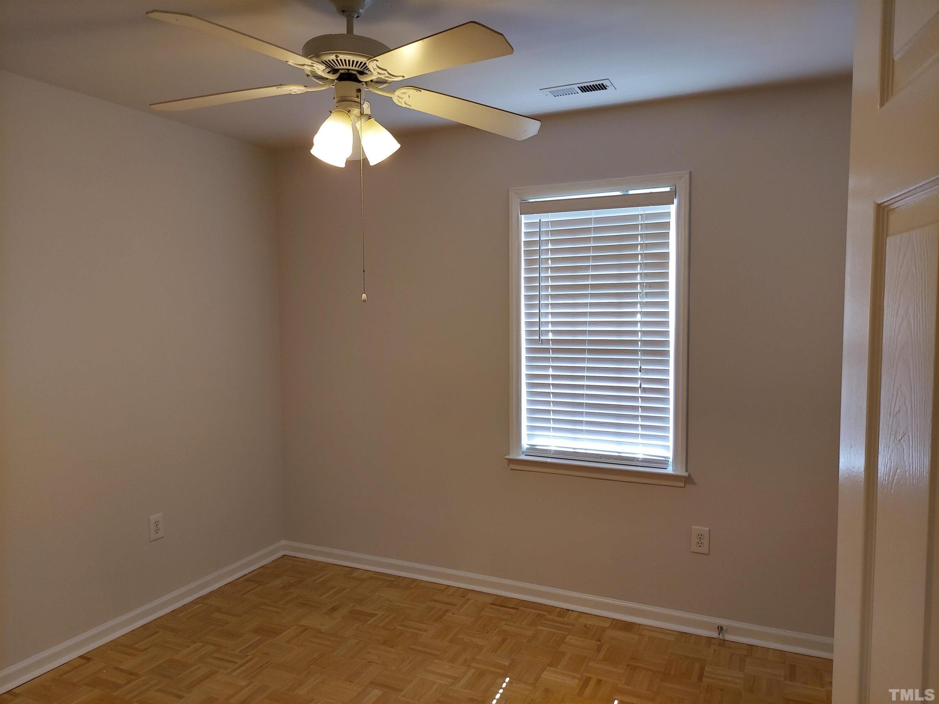 224 Crossfire Road Holly Springs, NC 27540 - Photo 26 of 43 an empty room with a window and a fan