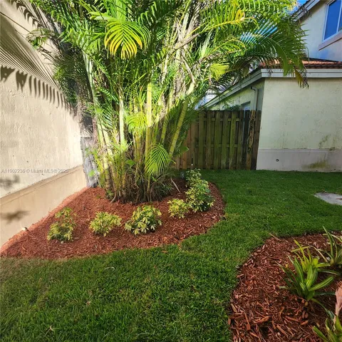 a view of a backyard with plants