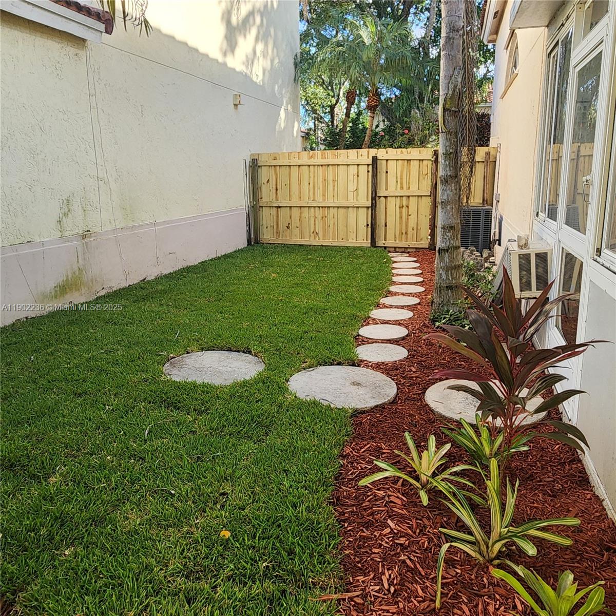 11281 Reveille Road Cooper City, FL 33026 - Photo 32 of 42 a view of a backyard with white house