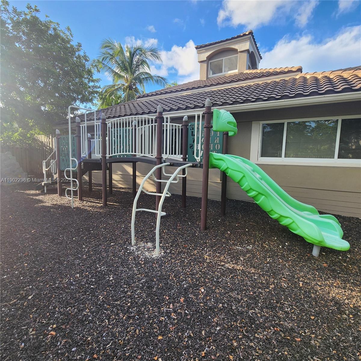 11281 Reveille Road Cooper City, FL 33026 - Photo 39 of 42 a view of a house with backyard and chairs