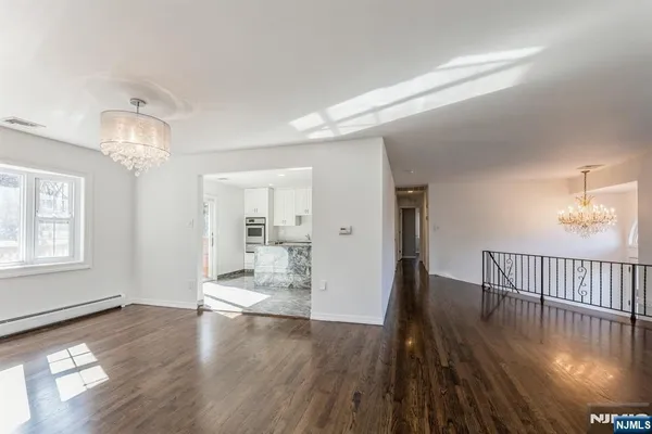 a view of a livingroom with wooden floor