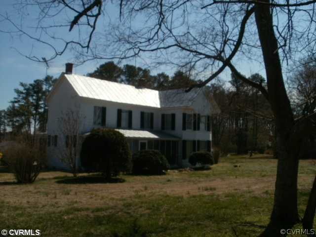 352 Ottoman Ferry Road Lancaster, VA 22503 - Photo 1 of 1 a front view of a house with a yard