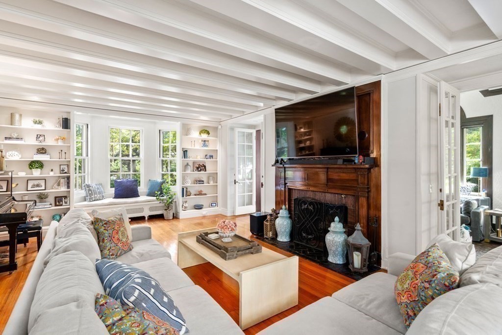 21 Windsor Road Wellesley, MA 02481 - Photo 13 of 28 a living room with furniture a flat screen tv and a fireplace