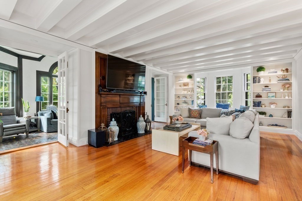 21 Windsor Road Wellesley, MA 02481 - Photo 14 of 28 a living room with furniture and a fireplace