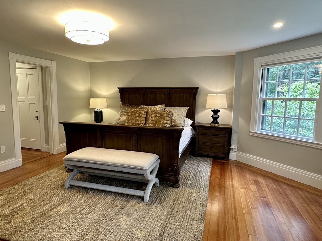 21 Windsor Road Wellesley, MA 02481 - Photo 16 of 28 a bedroom with a bed and wooden floor