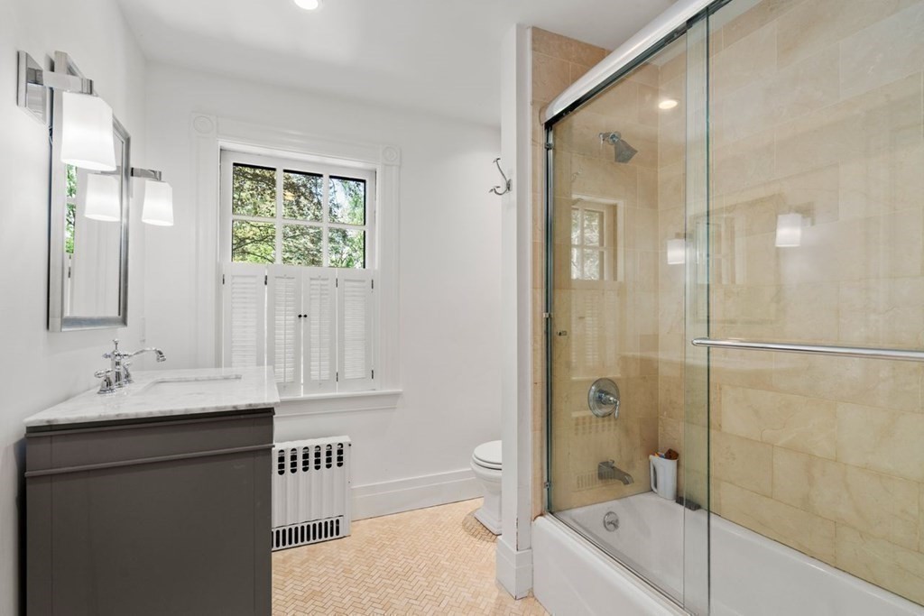 21 Windsor Road Wellesley, MA 02481 - Photo 19 of 28 a bathroom with a sink a toilet and shower