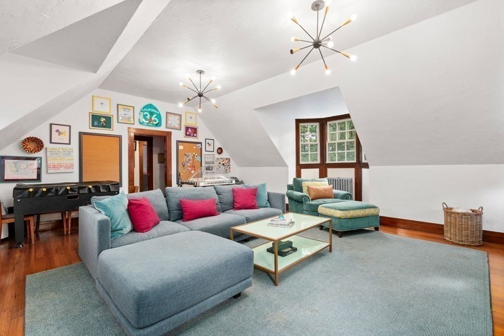 21 Windsor Road Wellesley, MA 02481 - Photo 24 of 28 a living room with furniture a chandelier and a window