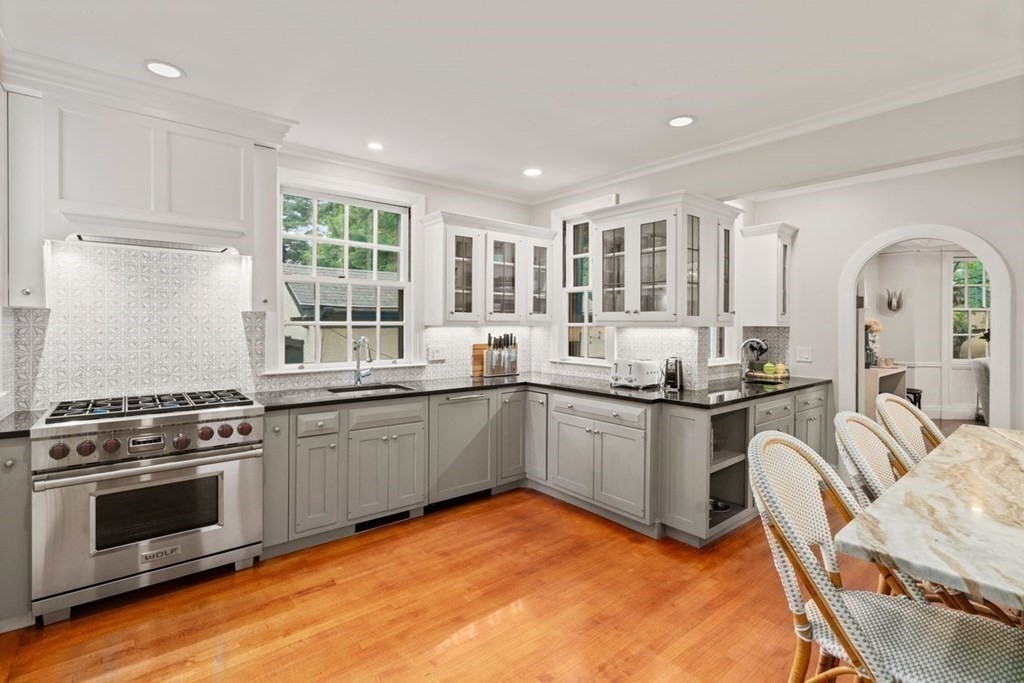 21 Windsor Road Wellesley, MA 02481 - Photo 5 of 28 a kitchen with granite countertop a stove and a sink