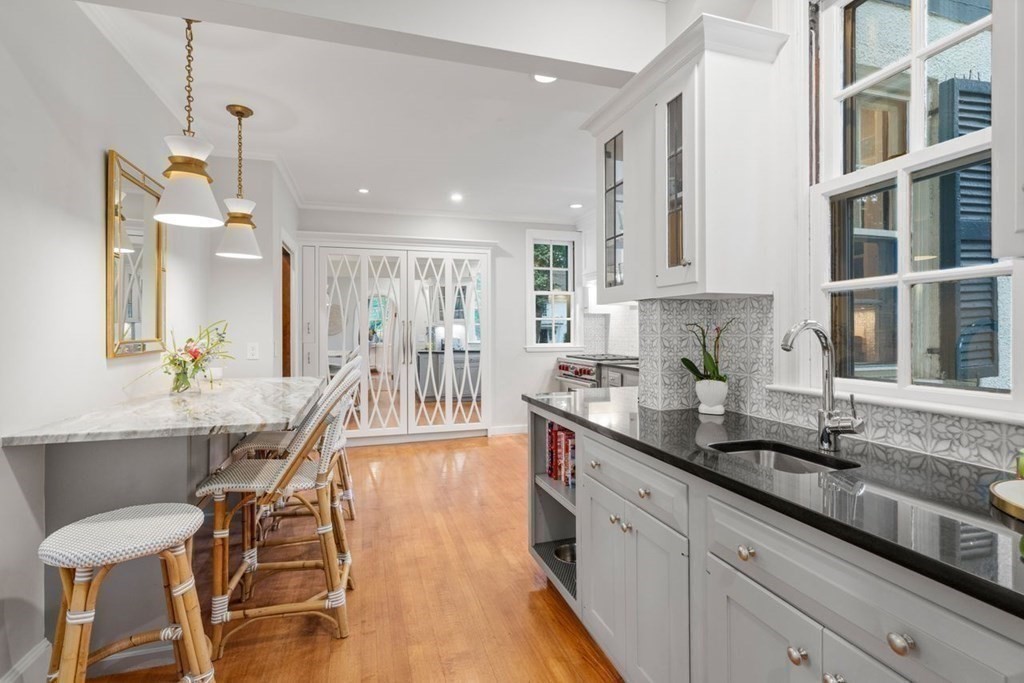 21 Windsor Road Wellesley, MA 02481 - Photo 7 of 28 a large kitchen with granite countertop lots of counter space and a sink