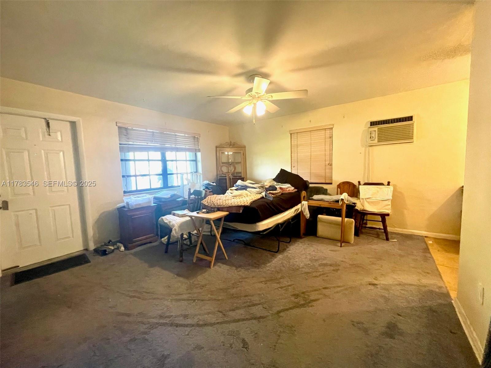 5455 Southwest 116th Avenue Miami, FL 33165 - Photo 3 of 18 a living room with furniture and a window