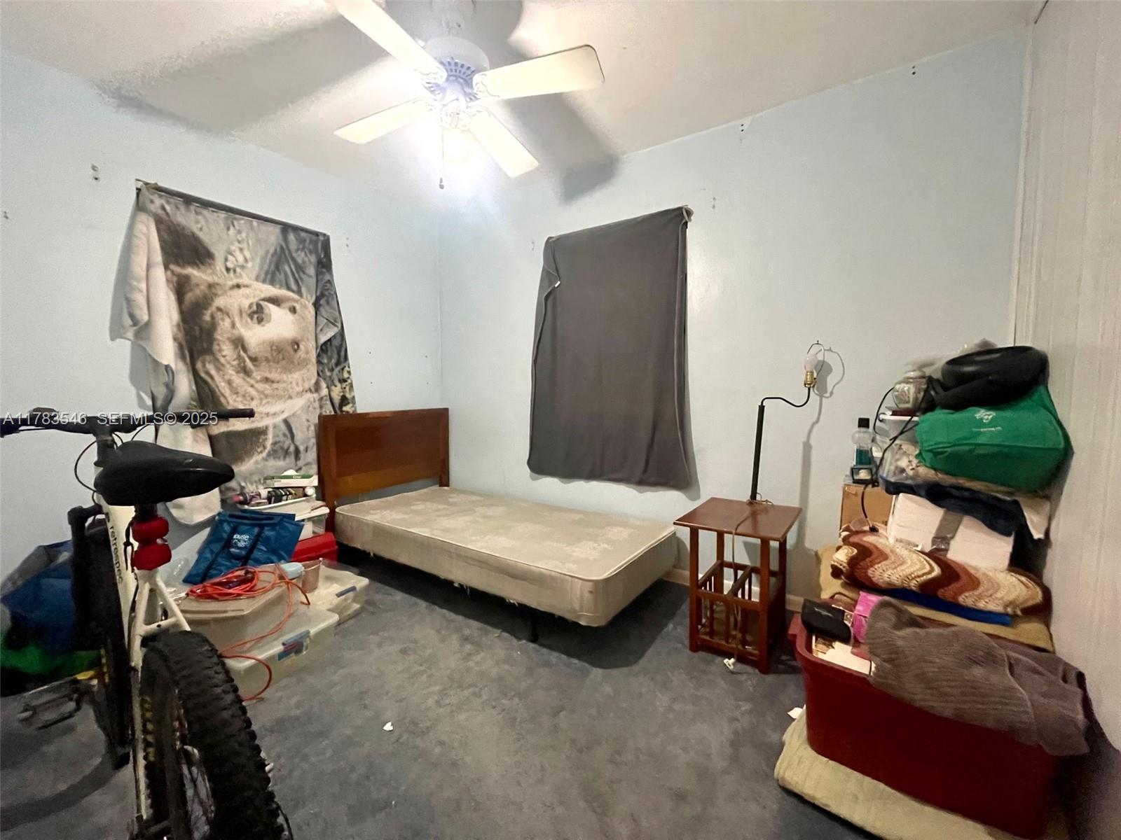 5455 Southwest 116th Avenue Miami, FL 33165 - Photo 6 of 18 a living room with furniture and a flat screen tv