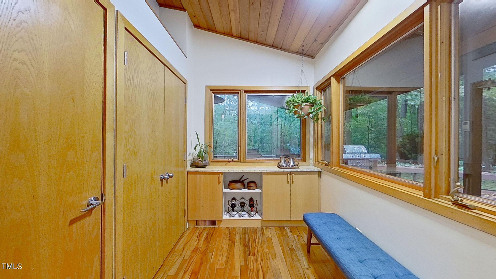 12012 Peed Road Raleigh, NC 27614 - Photo 17 of 48 a view of a large kitchen with wooden floor and a large window
