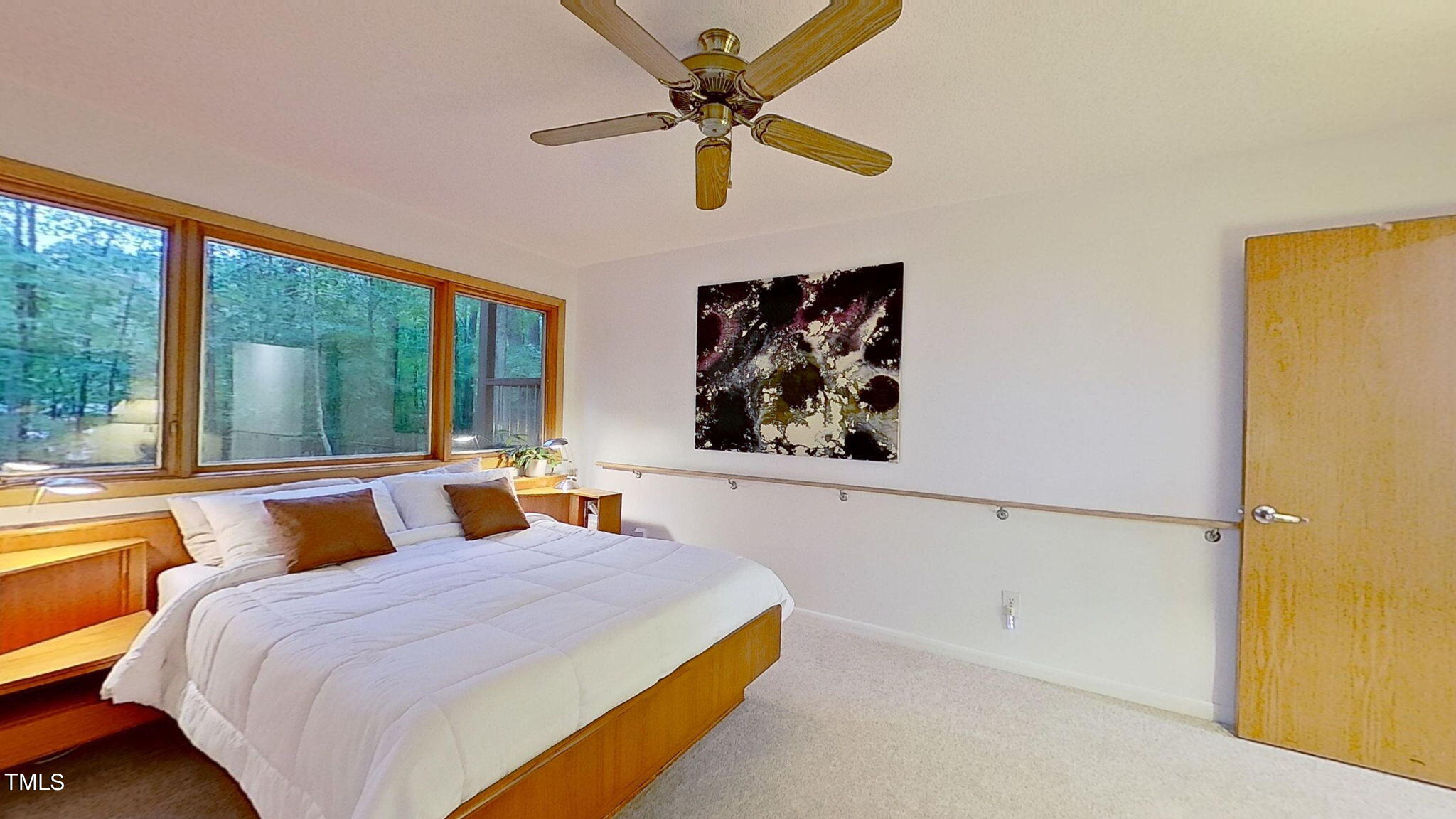12012 Peed Road Raleigh, NC 27614 - Photo 20 of 48 a bedroom with a bed and a large window