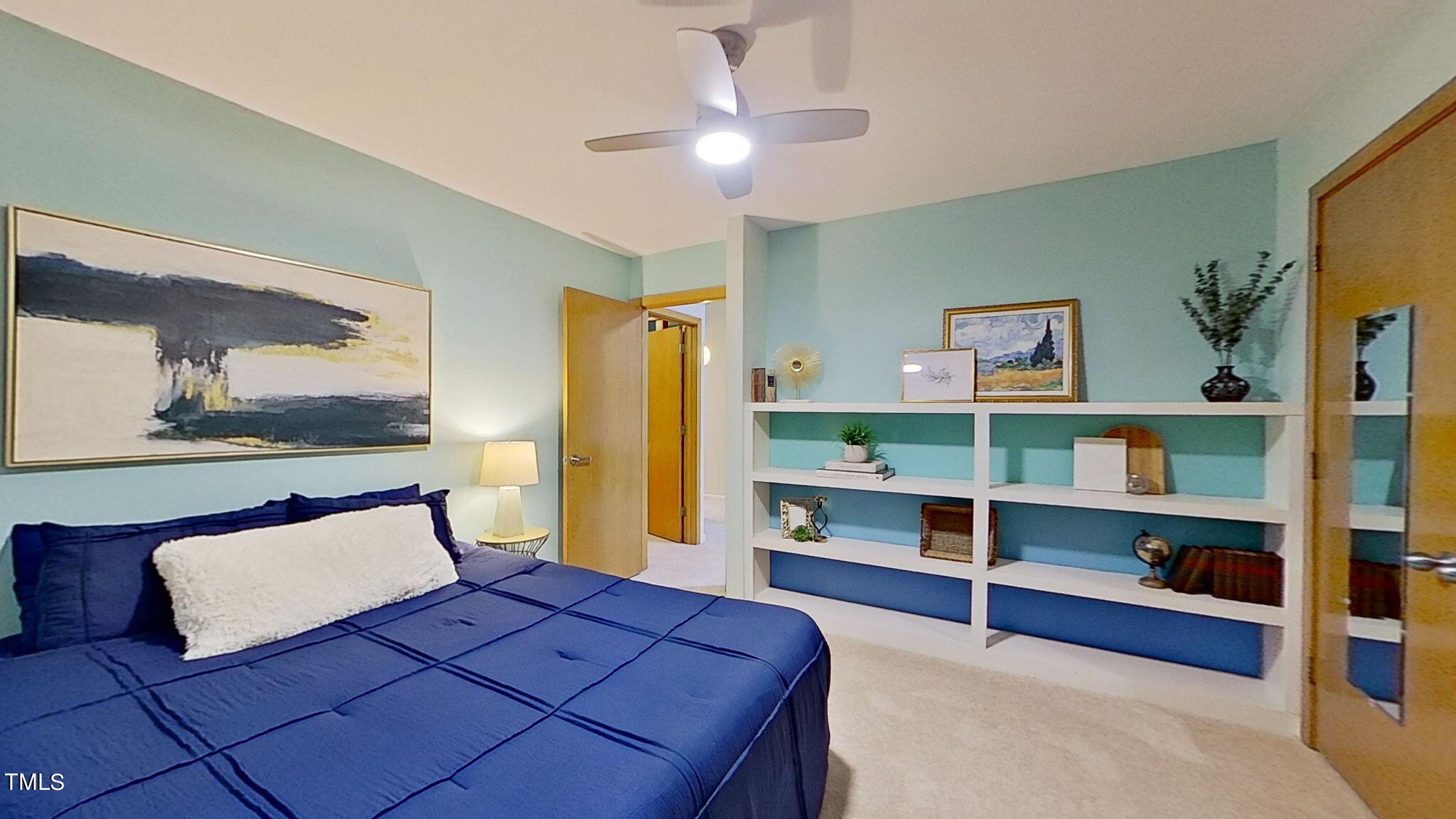 12012 Peed Road Raleigh, NC 27614 - Photo 24 of 48 a bedroom with a large bed and a chandelier
