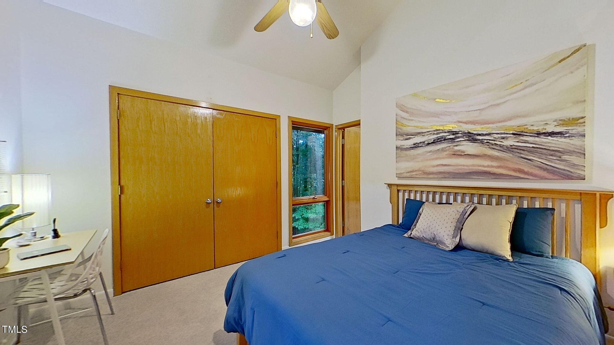 12012 Peed Road Raleigh, NC 27614 - Photo 25 of 48 a bedroom with a bed and a chandelier