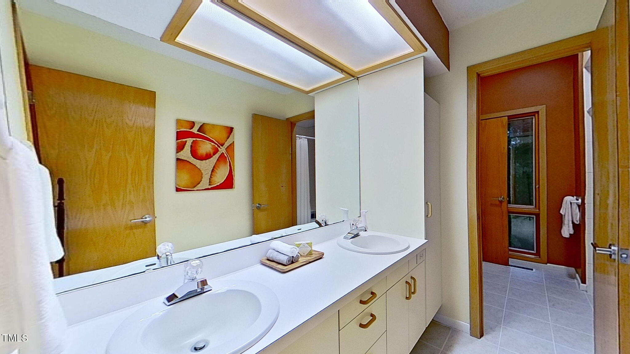 12012 Peed Road Raleigh, NC 27614 - Photo 28 of 48 a bathroom with a sink and a mirror