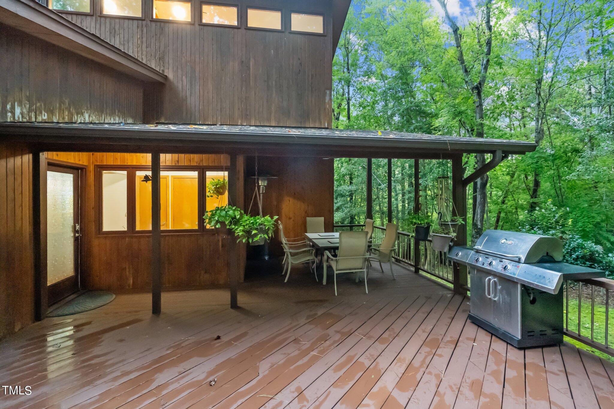 12012 Peed Road Raleigh, NC 27614 - Photo 30 of 48 a balcony with wooden floor table and chairs