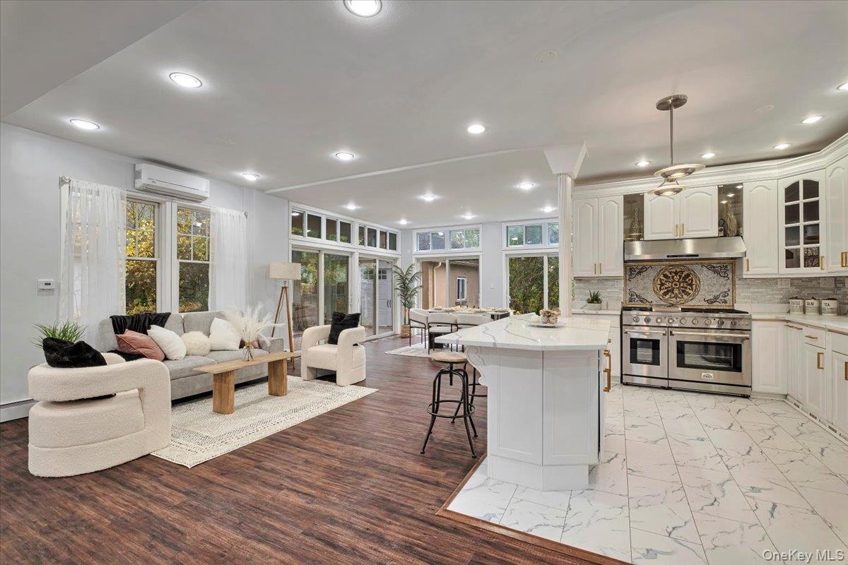 193 Nelson Road Scarsdale, NY 10583 - Photo 11 of 37 a living room with stainless steel appliances furniture and a wooden floor