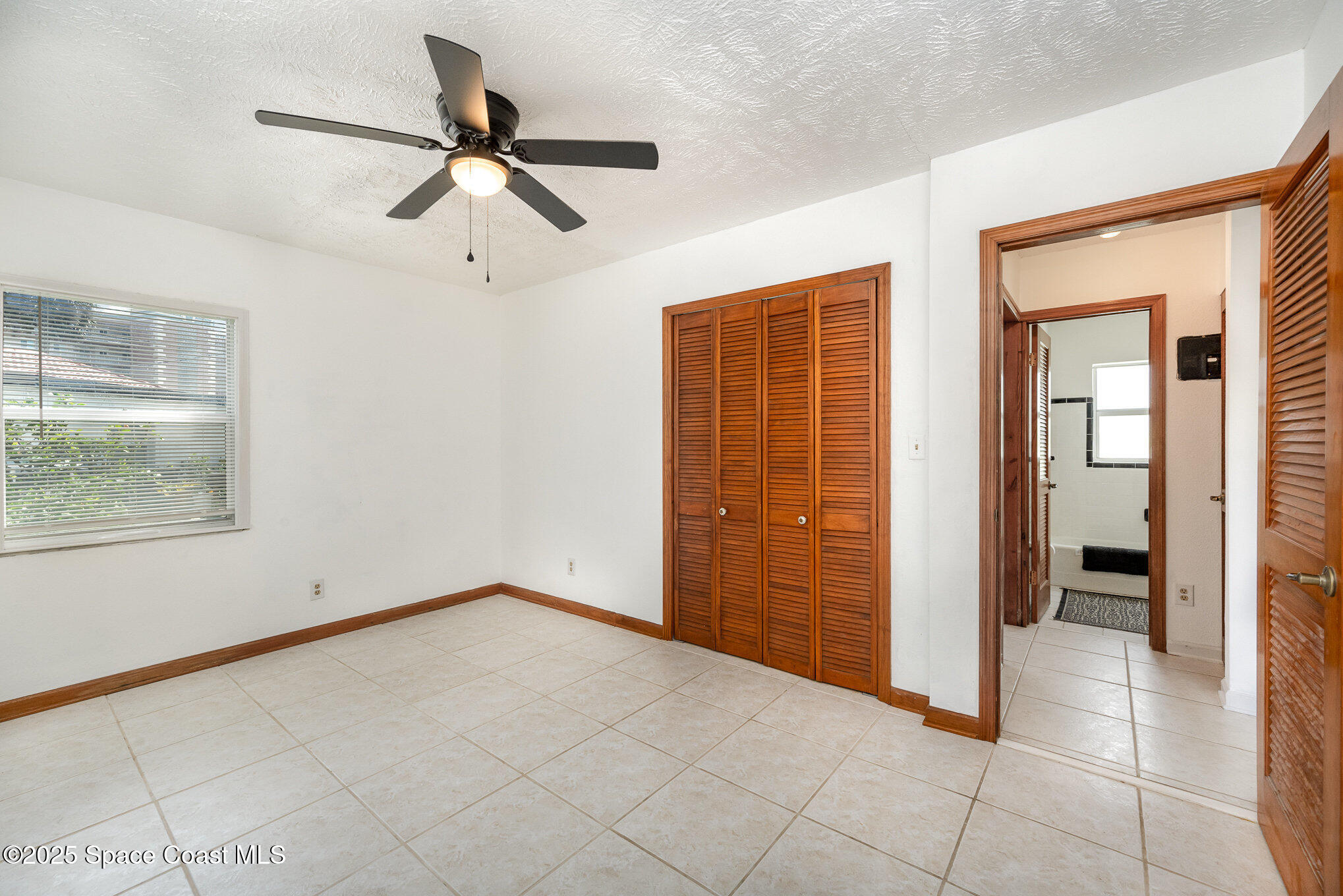 121 Del Flora Indialantic, FL 32903 - Photo 12 of 15 an empty room with closet and windows