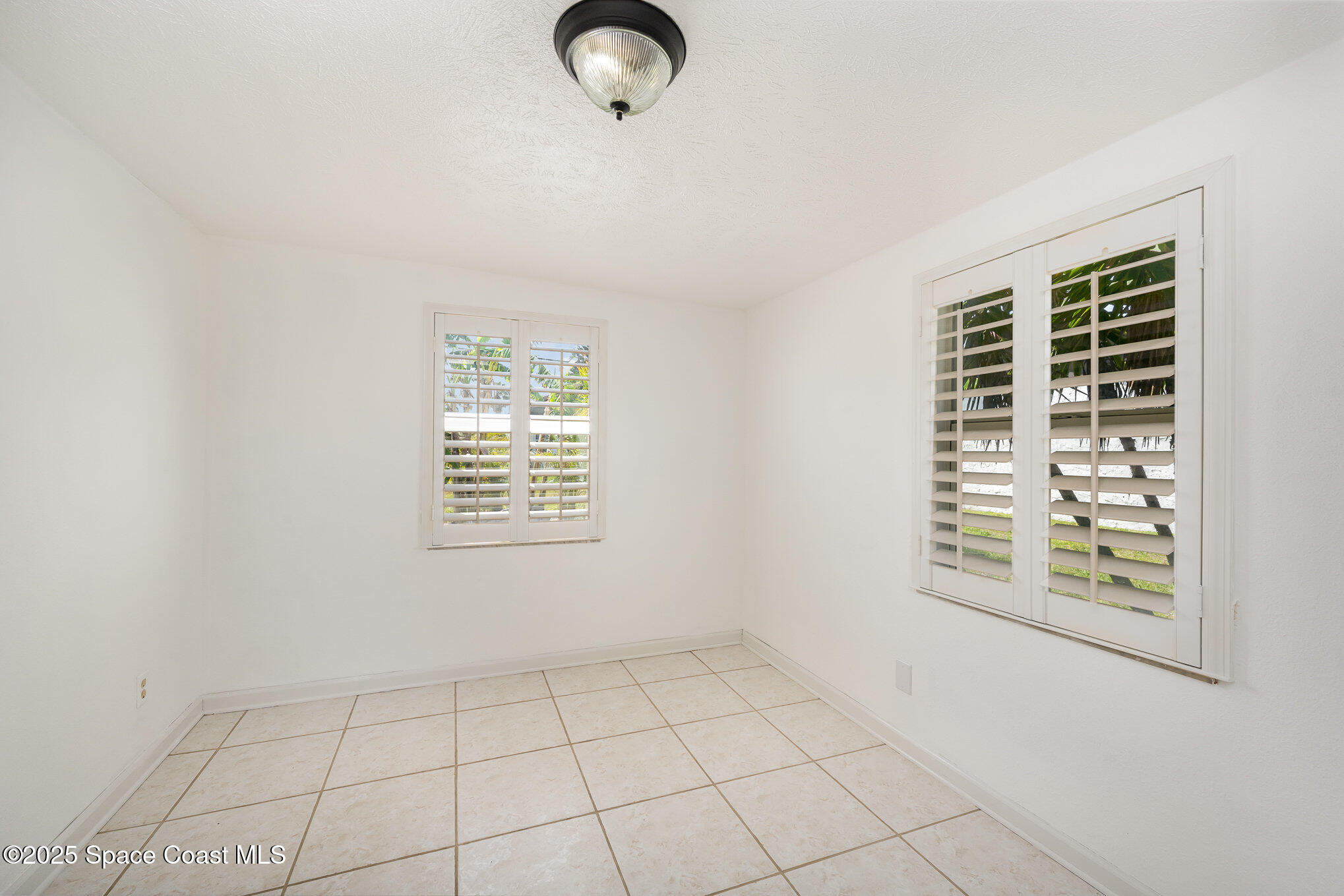 121 Del Flora Indialantic, FL 32903 - Photo 10 of 15 an empty room with windows