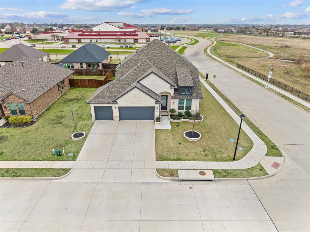 417 Ardsley Lane Forney, TX 75126 - Photo 2 of 31 an aerial view of a house with a swimming pool