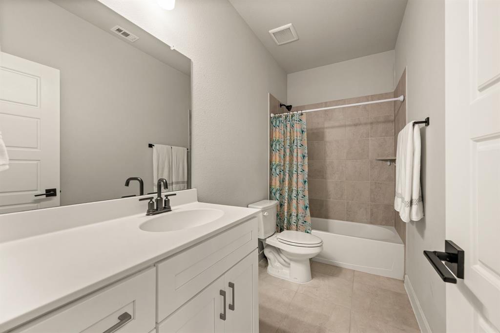 417 Ardsley Lane Forney, TX 75126 - Photo 22 of 31 a bathroom with a sink toilet tub and shower