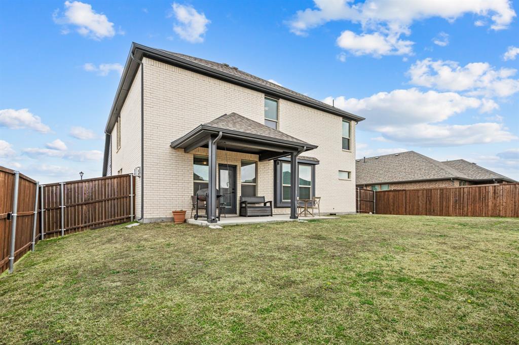 417 Ardsley Lane Forney, TX 75126 - Photo 25 of 31 a view of a house with backyard and porch