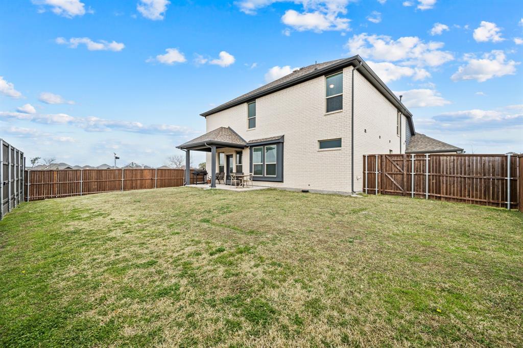 417 Ardsley Lane Forney, TX 75126 - Photo 26 of 31 a front view of a house with a yard