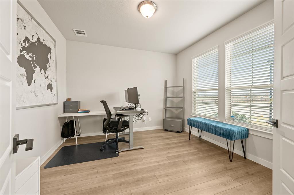417 Ardsley Lane Forney, TX 75126 - Photo 5 of 31 a view of a workspace with furniture and a window