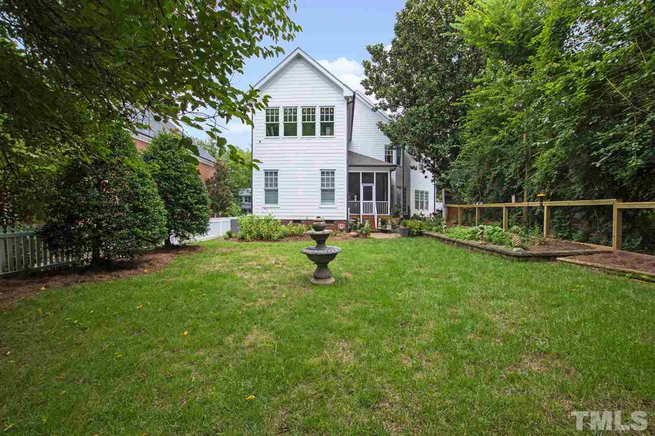 1907 McCarthy Street Raleigh, NC 27608 - Photo 14 of 30 a view of house with backyard and a garden