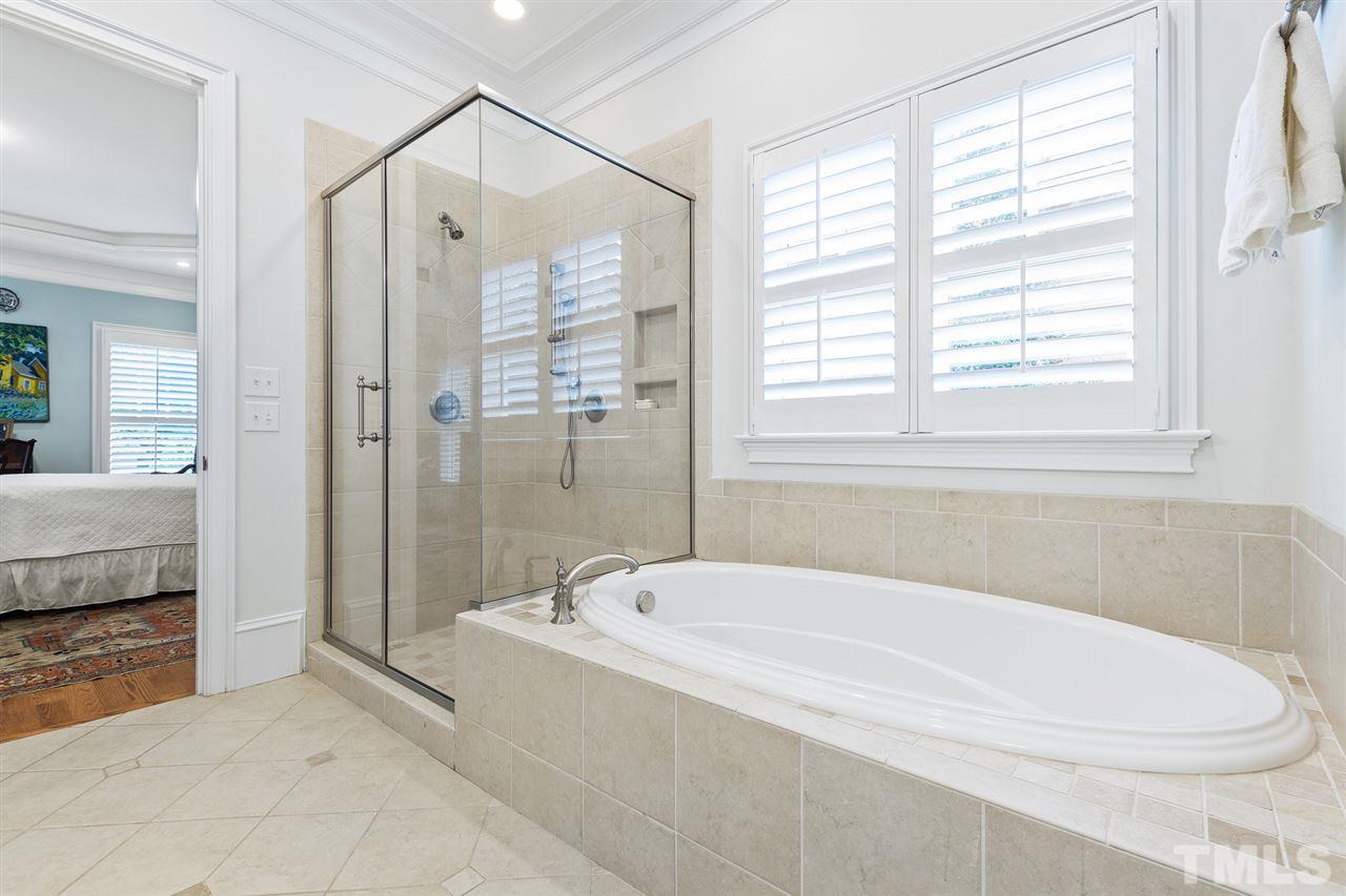 1907 McCarthy Street Raleigh, NC 27608 - Photo 18 of 30 a white bath tub sitting next to a bathroom
