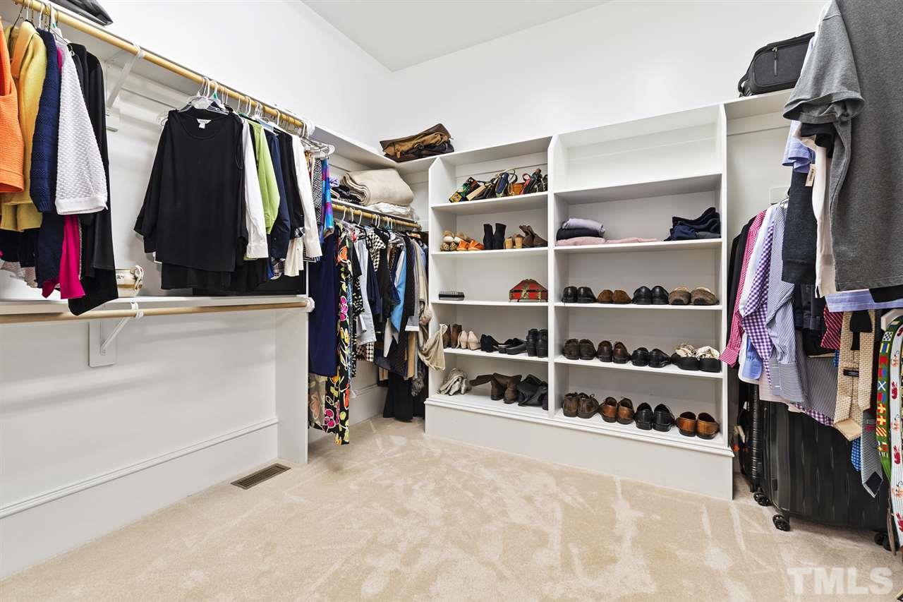 1907 McCarthy Street Raleigh, NC 27608 - Photo 20 of 30 a view of walk in closet with clothes and shoes