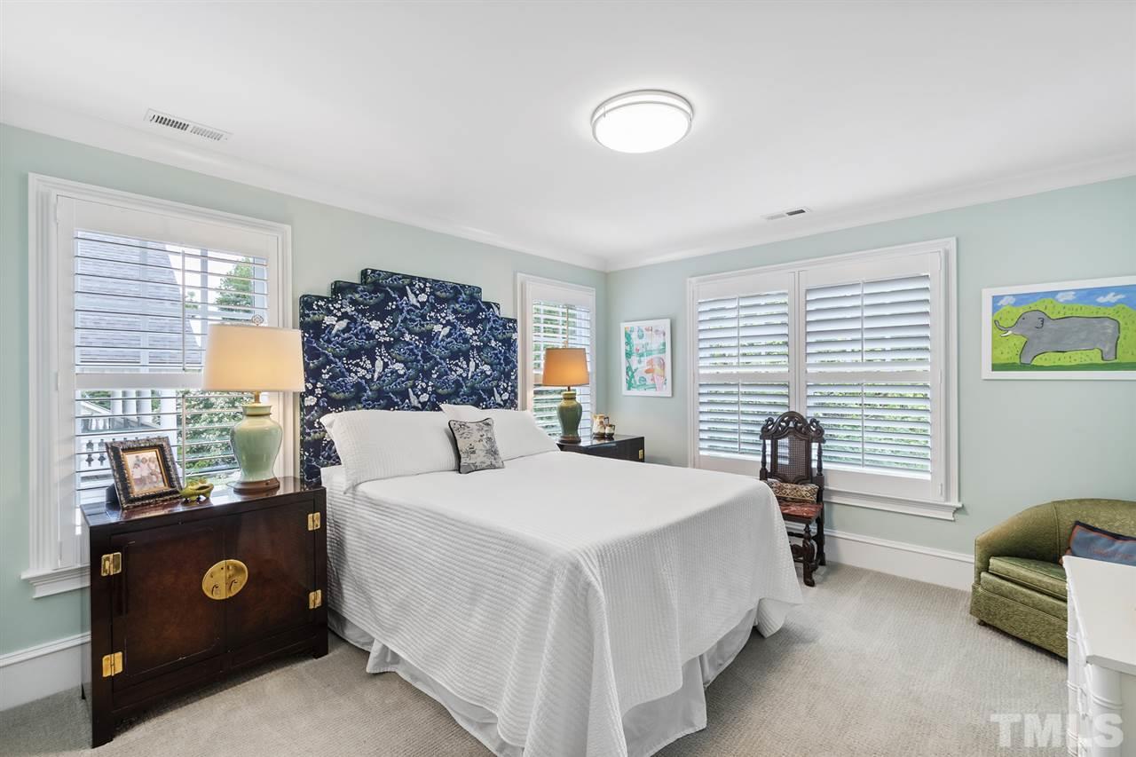 1907 McCarthy Street Raleigh, NC 27608 - Photo 21 of 30 a bedroom with a bed and a couch