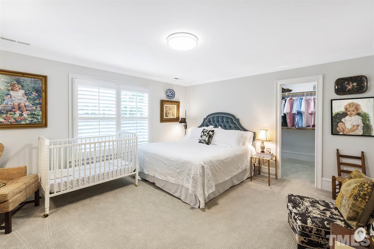 1907 McCarthy Street Raleigh, NC 27608 - Photo 25 of 30 a bedroom with a bed and a window