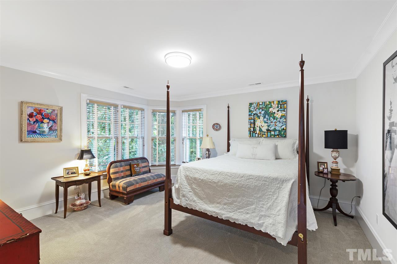 1907 McCarthy Street Raleigh, NC 27608 - Photo 26 of 30 a bedroom with a bed and large windows