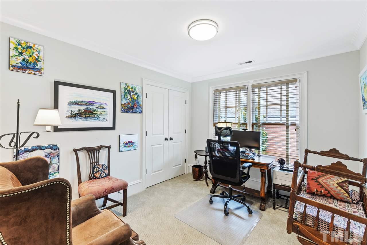 1907 McCarthy Street Raleigh, NC 27608 - Photo 27 of 30 a view of a livingroom with workspace and a couch