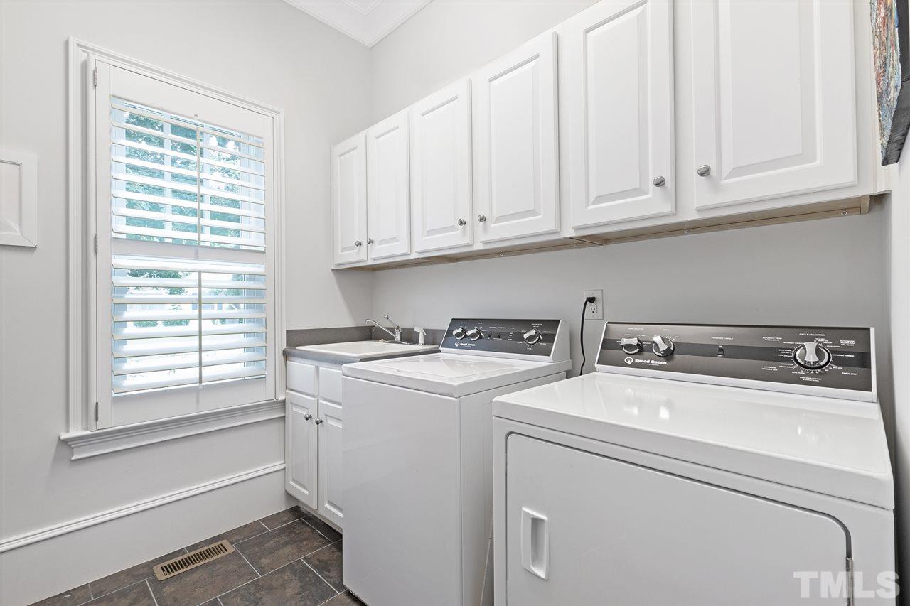 1907 McCarthy Street Raleigh, NC 27608 - Photo 29 of 30 a utility room with dryer and washer