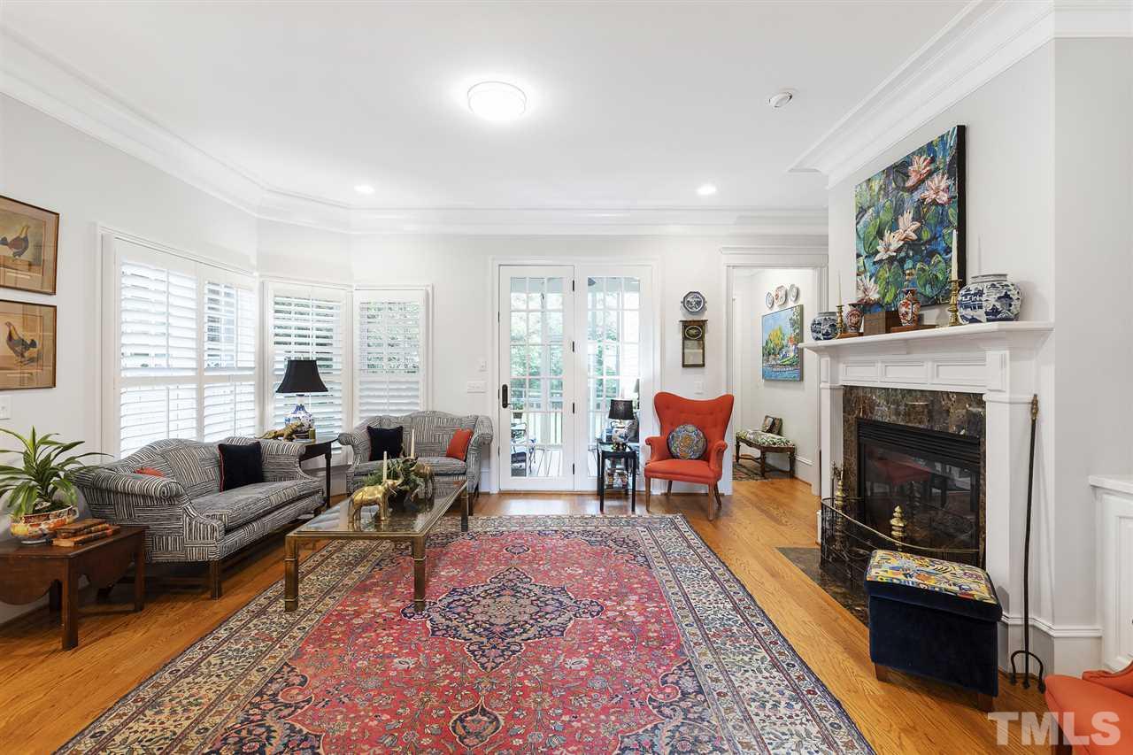1907 McCarthy Street Raleigh, NC 27608 - Photo 6 of 30 a living room with furniture and a fireplace