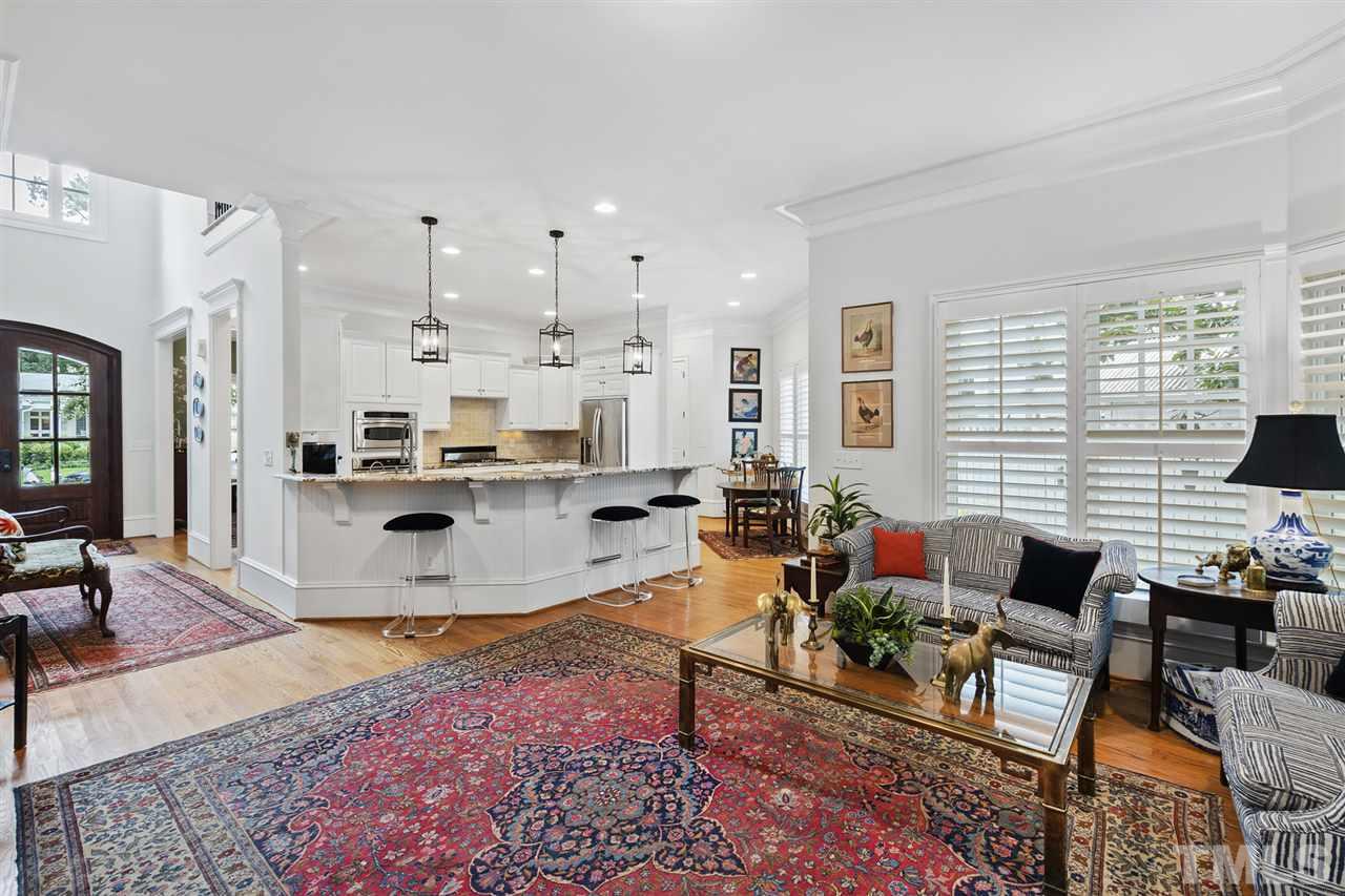 1907 McCarthy Street Raleigh, NC 27608 - Photo 7 of 30 a living room with furniture kitchen view and large windows