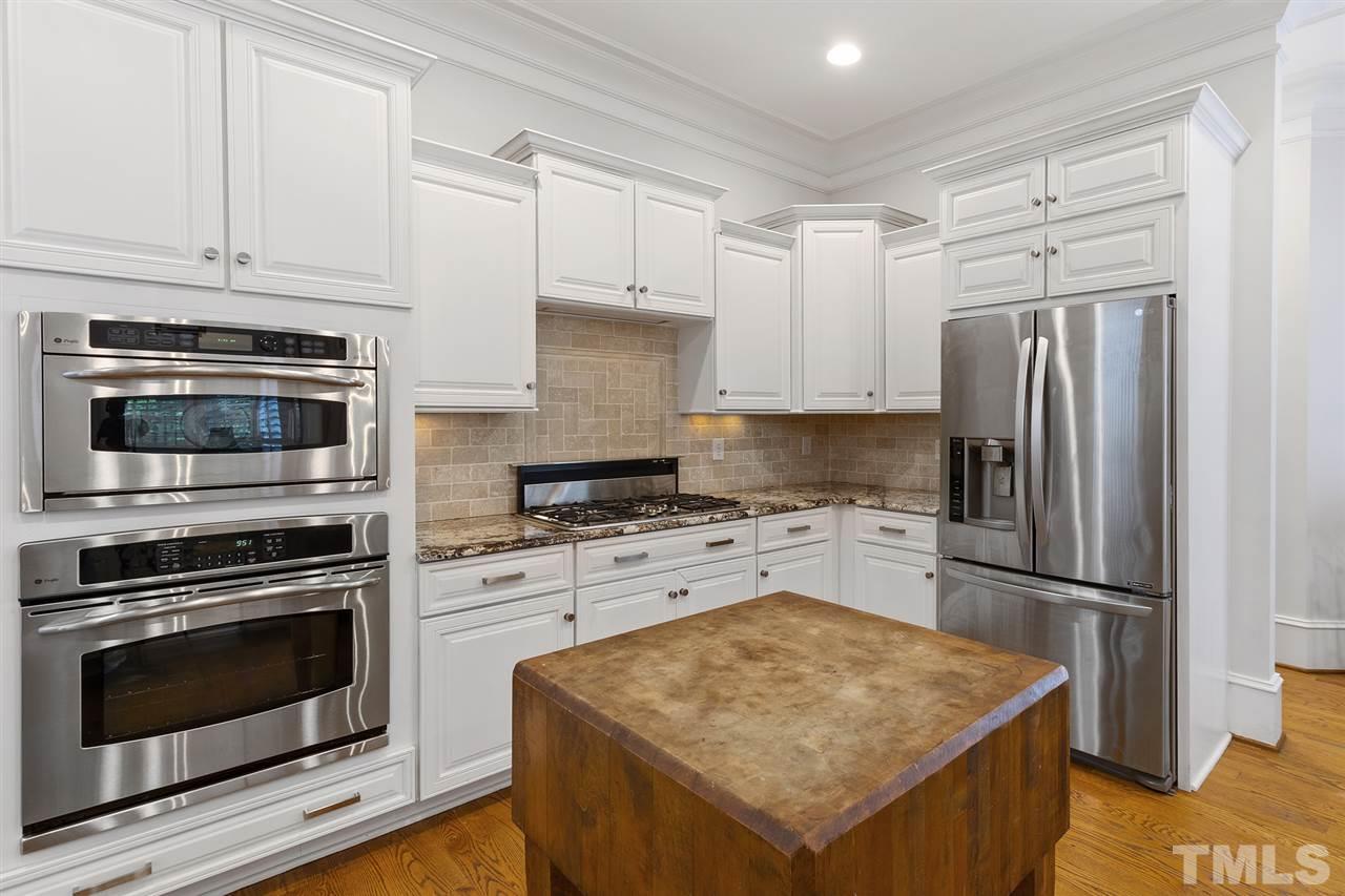 1907 McCarthy Street Raleigh, NC 27608 - Photo 10 of 30 a kitchen with a stove oven and a refrigerator