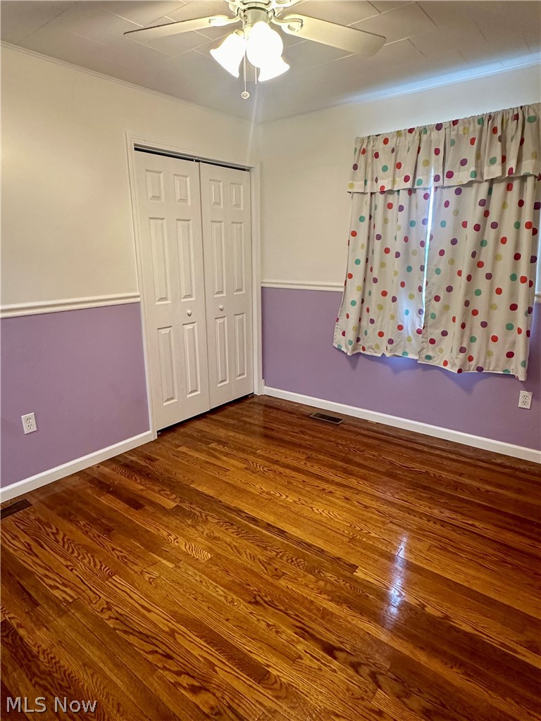 6855 Old Town Road Mount Perry, OH 43760 - Photo 20 of 38 Unfurnished bedroom with a closet, wood-type flooring, and ceiling fan