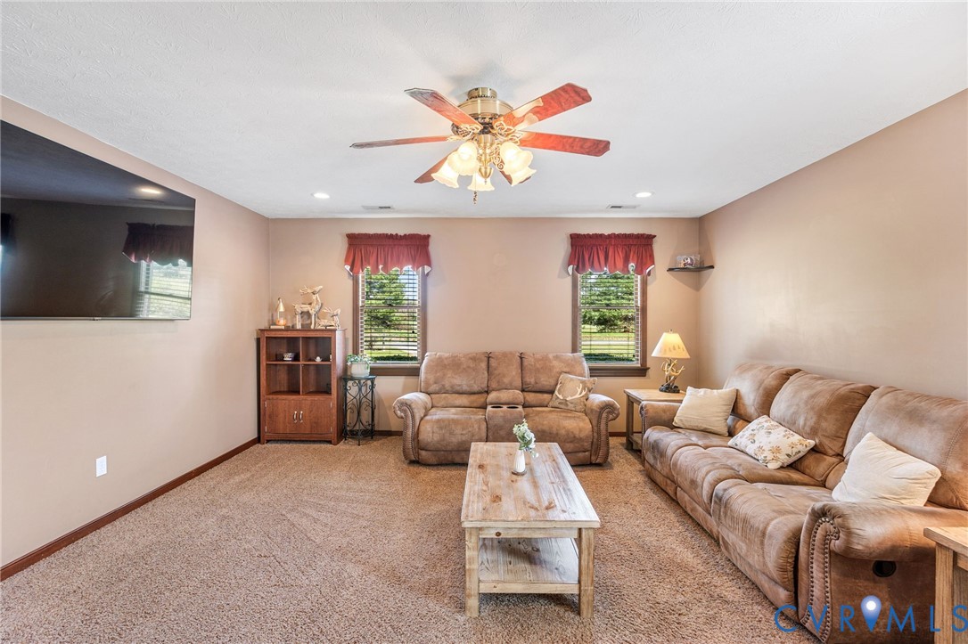 3411 Spring Run Road Mechanicsville, VA 23111 - Photo 24 of 41 a living room with furniture and a flat screen tv