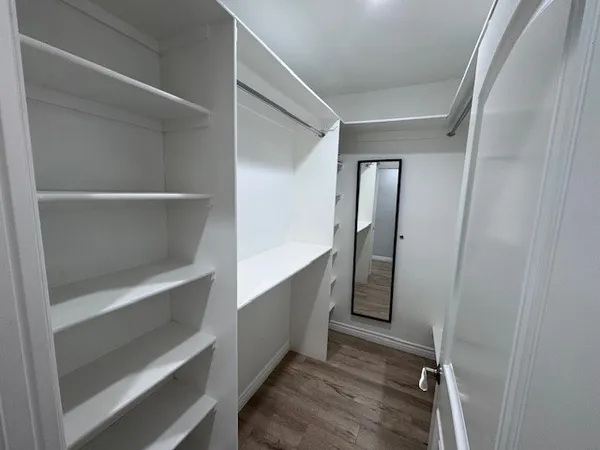 a view of an empty walk in closet