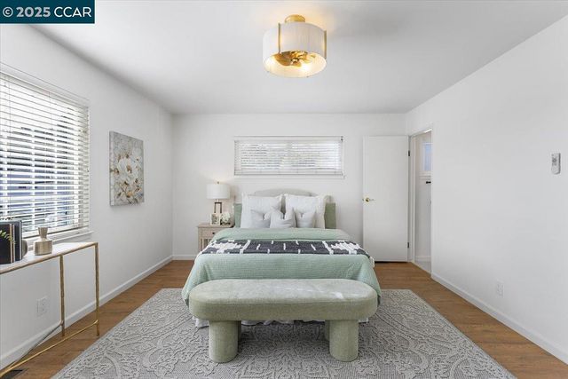a bathroom with a toilet a sink and a mirror