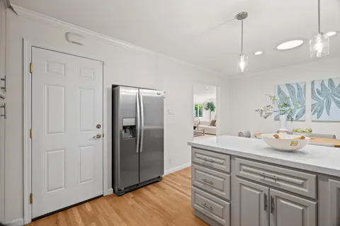 a kitchen with stainless steel appliances a refrigerator and a sink